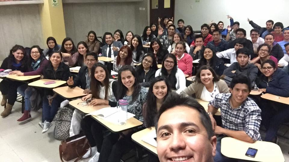 Diego Arias with students in a classroom